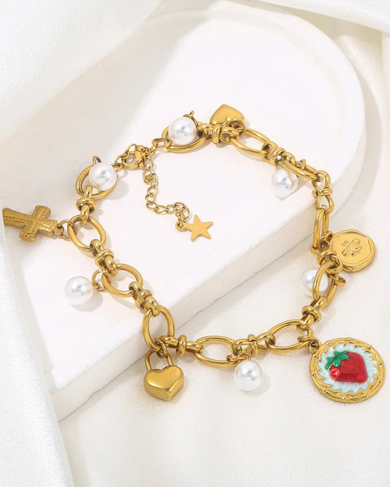 Amelie Charm Armband aus Edelstahl mit Perlen, Herz-, Kreuz- und Frucht-Anhänger