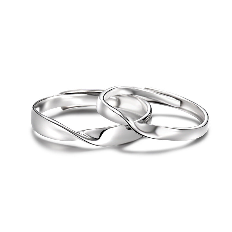 Eleganter Partnerring aus S999 Feinsilber mit sanfter Drehung – verstellbares Design als Symbol für Liebe, Balance und Harmonie