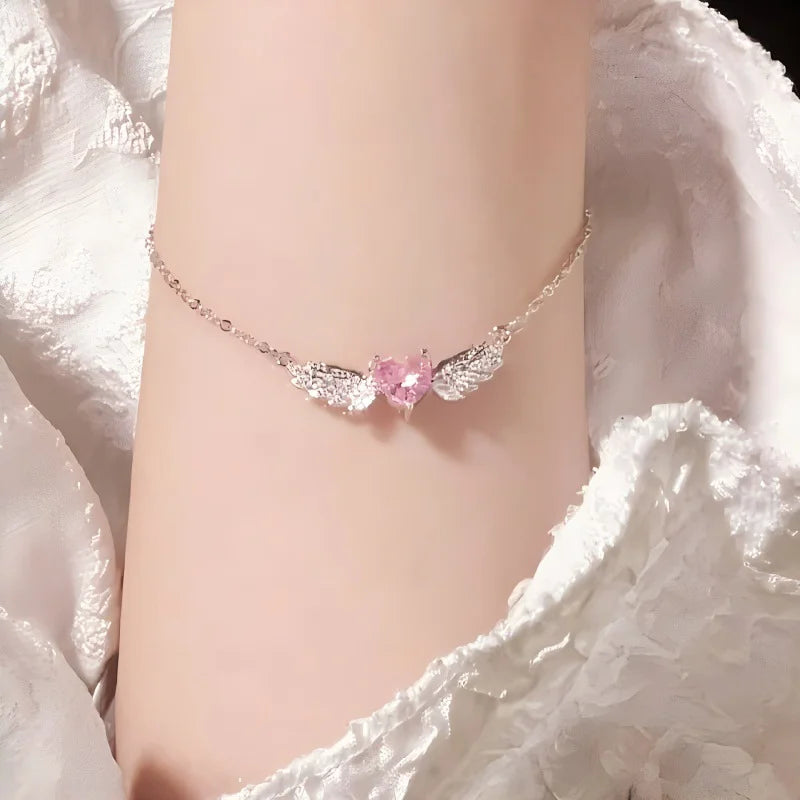 Zartes 925 Sterling Silber Armband "Angelina" mit einem rosa Zirkonia-Herz und funkelnden Engelsflügeln am Handgelenk
