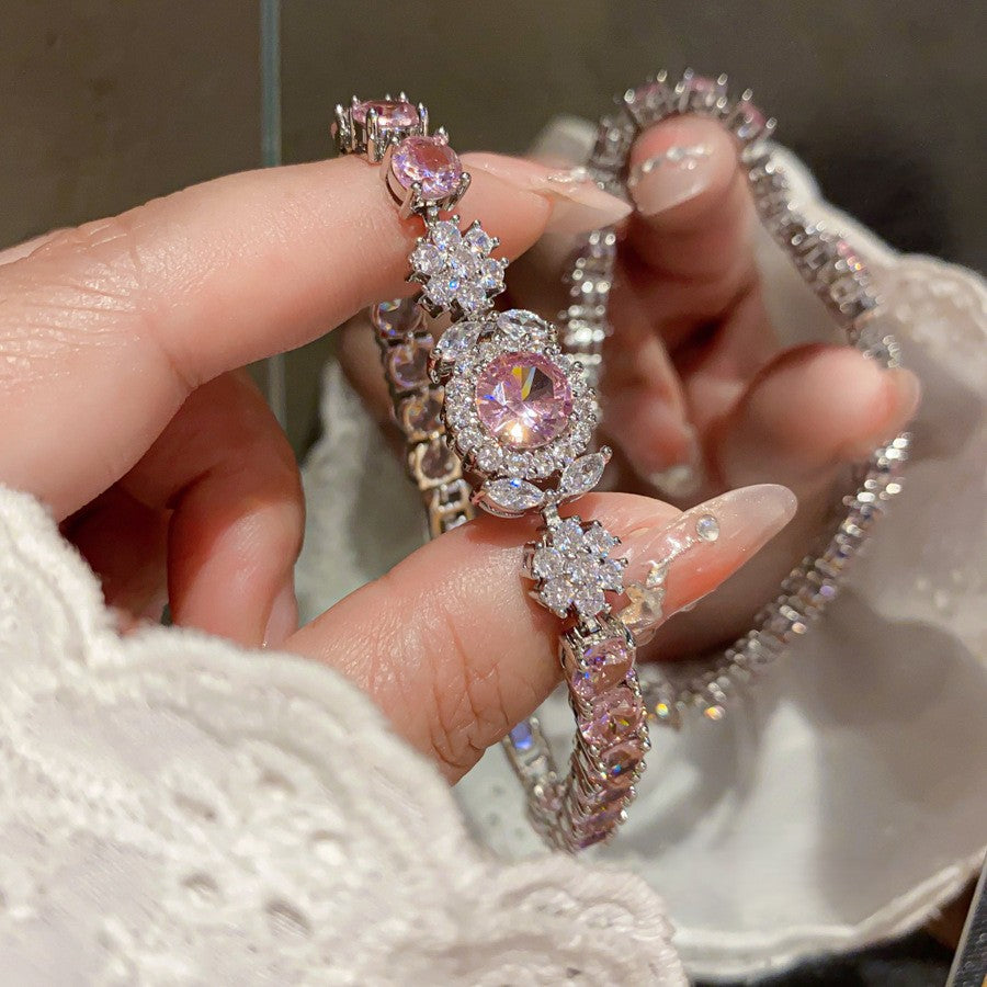 Luxuriöses silbernes Armband "Aurora" besetzt mit rosa und weißen Zirkonia-Blüten