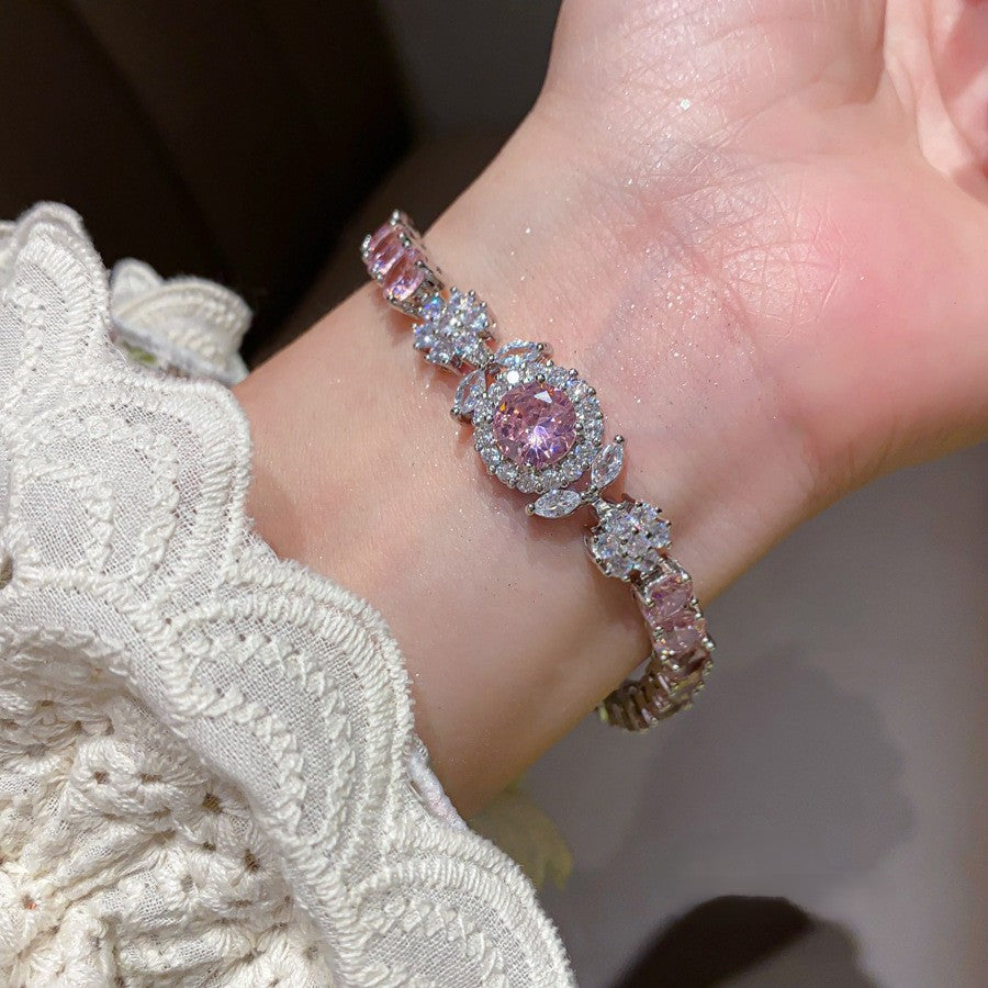 Luxuriöses silbernes Armband "Aurora" besetzt mit rosa und weißen Zirkonia-Blüten