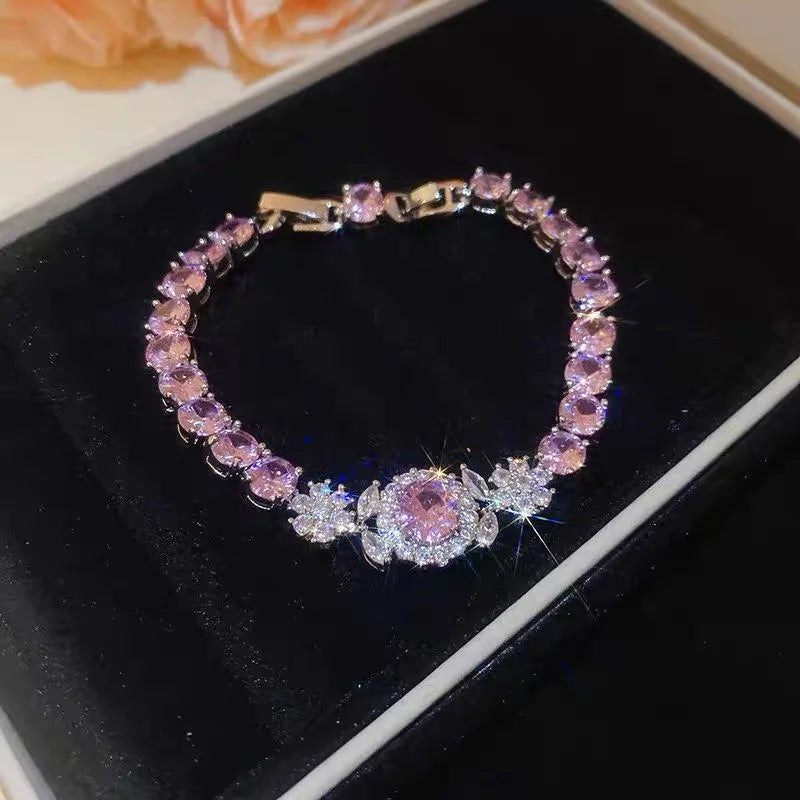 Luxuriöses silbernes Armband "Aurora" besetzt mit rosa und weißen Zirkonia-Blüten