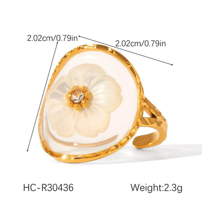 Vergoldeter Edelstahlring mit Blume aus Muschel in klarem Harz – romantisch, verstellbar, Statement-Look