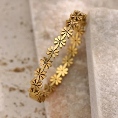 Massiver Titanstahl-Armreif "Daisy" im Blumen-Design mit Zirkonia-Steinen, 18g schwer, erhältlich in Gold und Silber