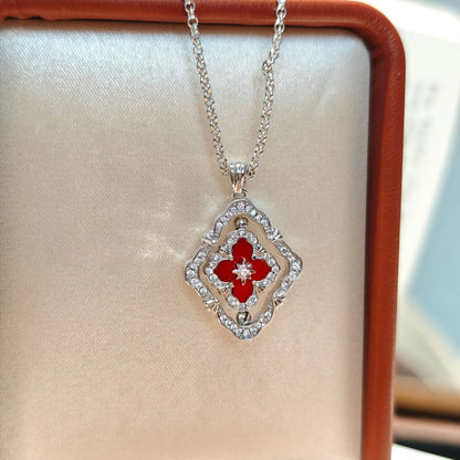 Goldene drehbare Halskette mit vierblättrigem Kleeblatt, rote Emaille und Zirkonia
