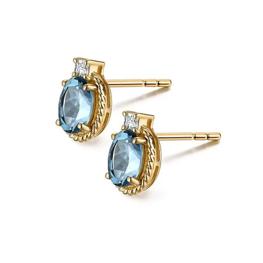 Goldene Ohrstecker mit ovalem blauem Aquamarin und kleinen Diamanten