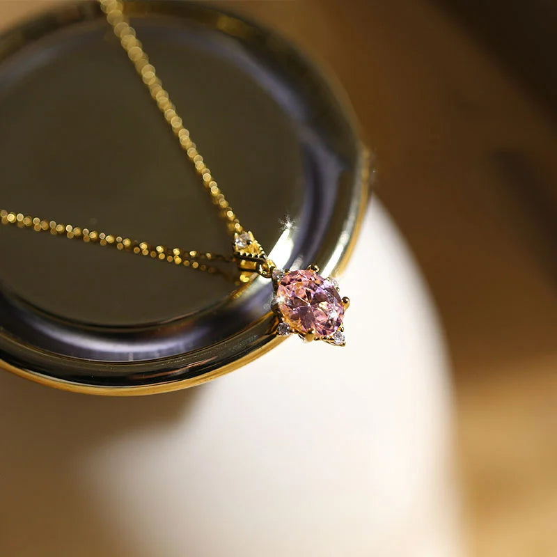 Goldene Halskette aus 925 Silber mit ovalem rosa Rosenquarz Anhänger
