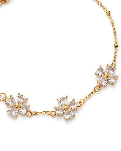 Vergoldetes Blumenarmband mit funkelnden Zirkonia Blüten