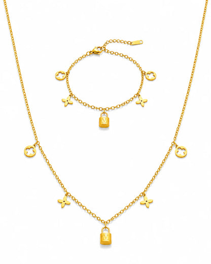 Goldenes Schmuckset aus Titanstahl bestehend aus Halskette und Armband mit Kleeblatt- und Schloss-Anhängern