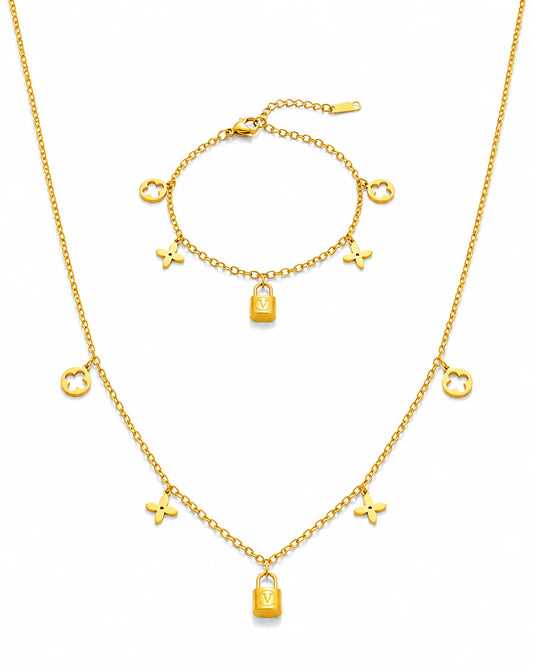 Goldenes Schmuckset aus Titanstahl bestehend aus Halskette und Armband mit Kleeblatt- und Schloss-Anhängern