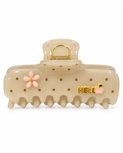 Cremebeige Hello Peach Haarkralle aus PC-Kunststoff mit rosa Blume, goldenem HELLO-Schriftzug und Pfirsichmotiv auf weißem Hintergrund