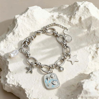 Silbernes Titanstahl-Armband "Marina" mit Meeres-Anhängern (Muschel, Seestern) und Emaille-Plättchen