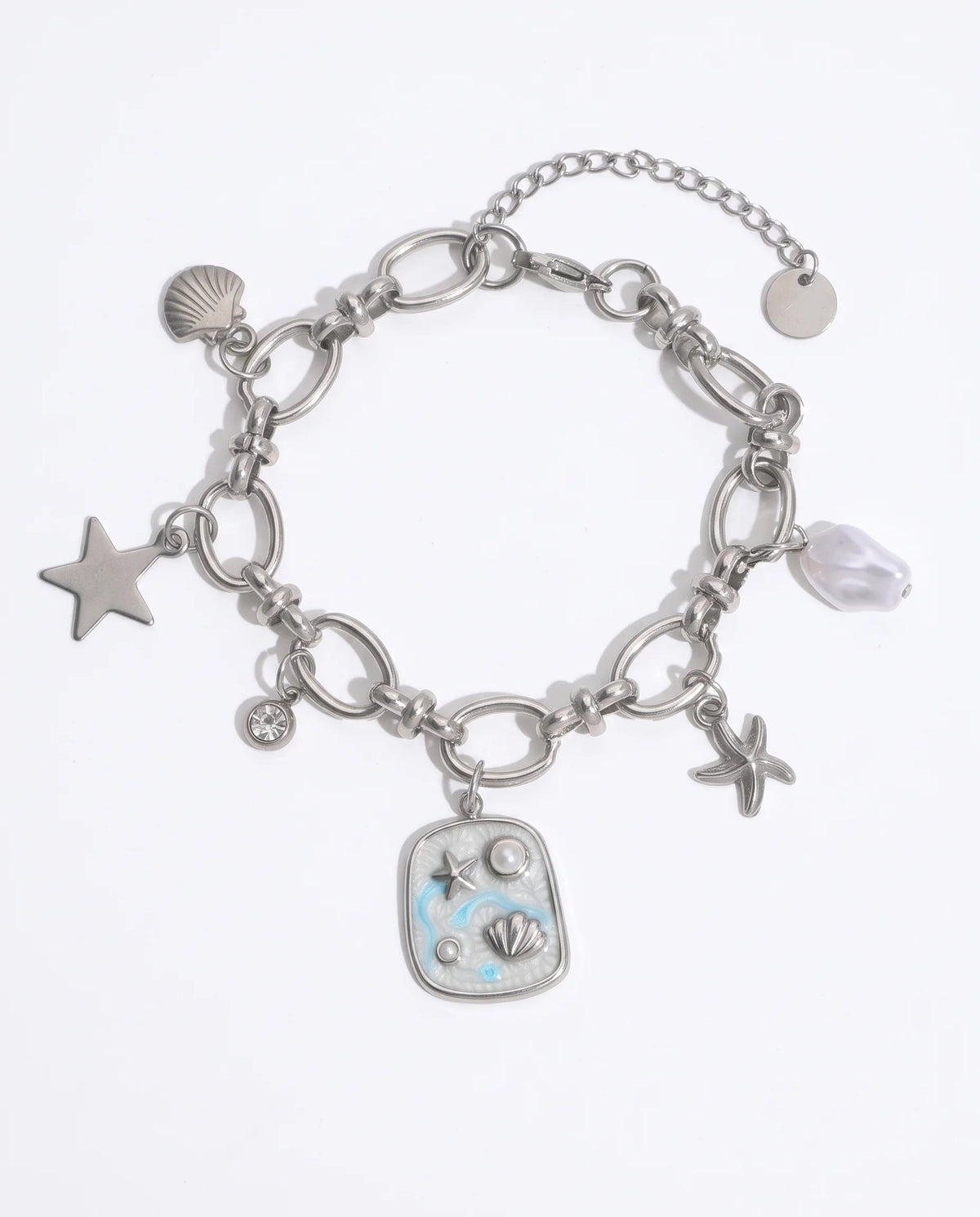 Marina Charm Armband aus silberfarbenem Edelstahl mit maritimen Anhängern und blauem Emaille-Detail