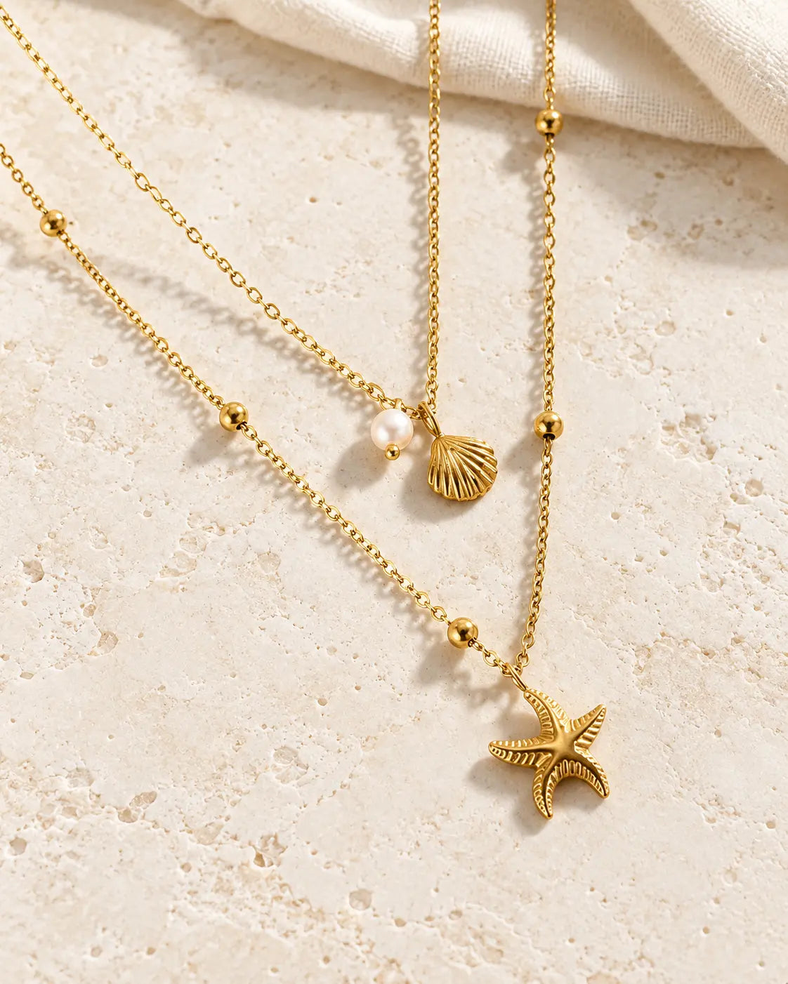 Layering Halskette mit Seestern Muschel und Kristallanhänger in Gold