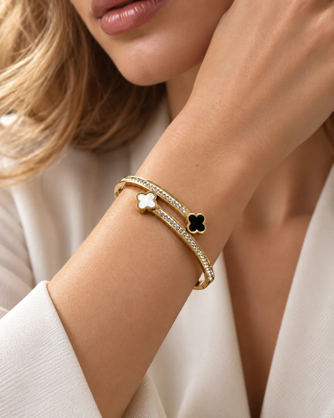 Detail of the Mila clover bangle with double bands and cubic zirconia