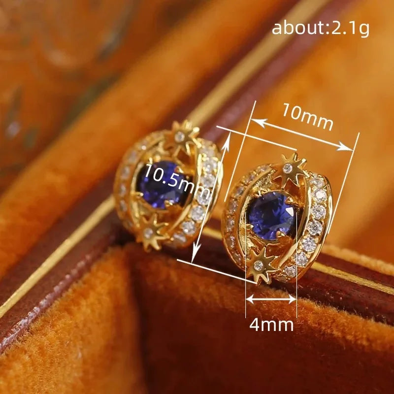 Goldene Ohrstecker aus Sterlingsilber mit blauem Tanzanit und Kristallen