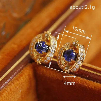 Goldene Ohrstecker aus Sterlingsilber mit blauem Tanzanit und Kristallen