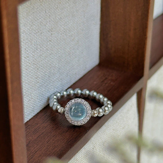 Handgefertigter Ring aus 925er Silber mit Aquamarin und schimmernden Swarovski Kristallperlen, eleganter Edelstein-Schmuck