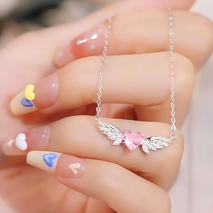 Filigrane 925 Sterling Silber Halskette "Seraphina" mit rosa Zirkonia-Herz und funkelnden Engelsflügeln