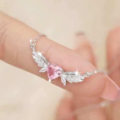 Filigrane 925 Sterling Silber Halskette "Seraphina" mit rosa Zirkonia-Herz und funkelnden Engelsflügeln