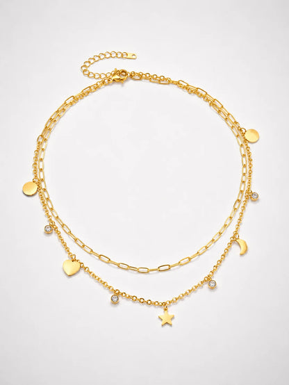 Mehrreihige Stern & Mond Layering Halskette aus 18K vergoldetem Titanstahl mit verschiedenen Charms und Zirkonia-Kristallen