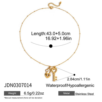 Goldene Halskette "Valentina" aus Edelstahl mit Herz-Schloss und Schlüssel-Anhängern sowie kleiner Perle
