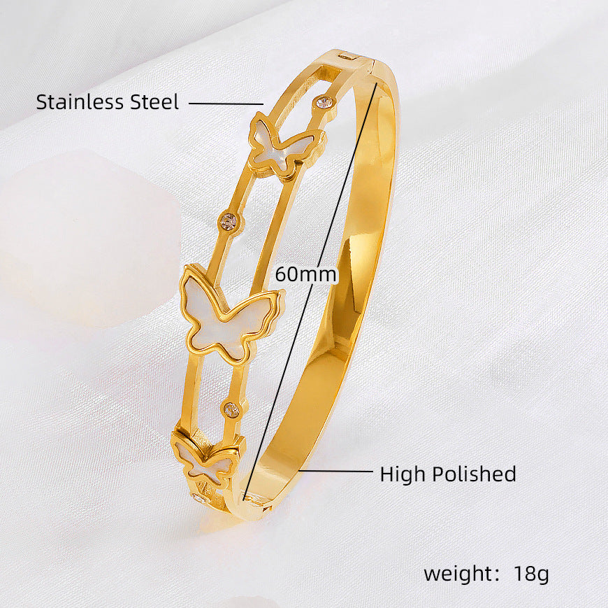 Vergoldeter Edelstahlarmreif mit doppelten Schmetterlingsmotiven und Zirkonia