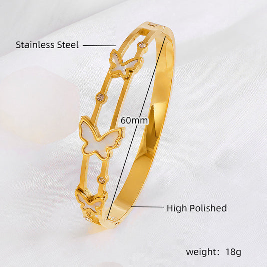 Vergoldeter Edelstahlarmreif mit doppelten Schmetterlingsmotiven und Zirkonia