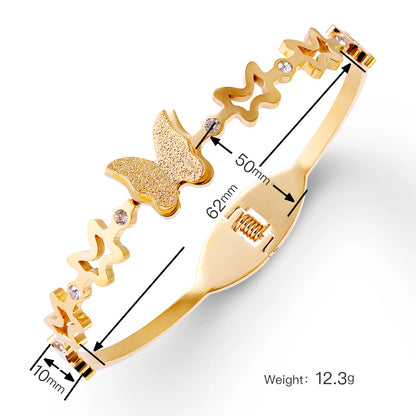 Vergoldeter Schmetterling Armreif mit Glitzeroptik und Zirkonia Steinen