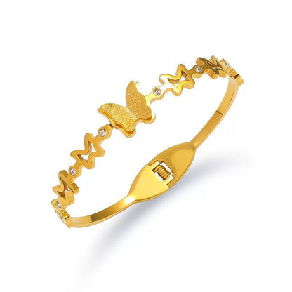 Vergoldeter Schmetterling Armreif mit Glitzeroptik und Zirkonia Steinen