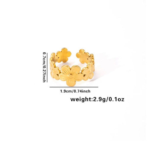 Vergoldeter Edelstahlring mit floralen Elementen in offener Form