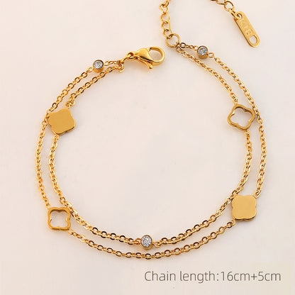 Vergoldetes Doppelarmband mit Kleeblatt- und Zirkonia-Elementen