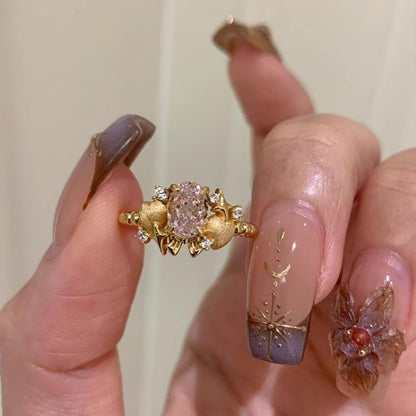 Goldener Vintage-Ring mit rosa Zirkonia im Prinzessinnen-Stil – verstellbar, mit Herz- und Strassdekor