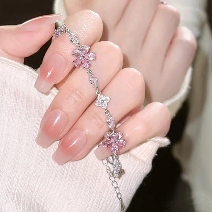 Massives 925 Sterling Silber Armband "Yuna" mit rosa Kirschblüten aus Zirkonia und silbernen Blättern
